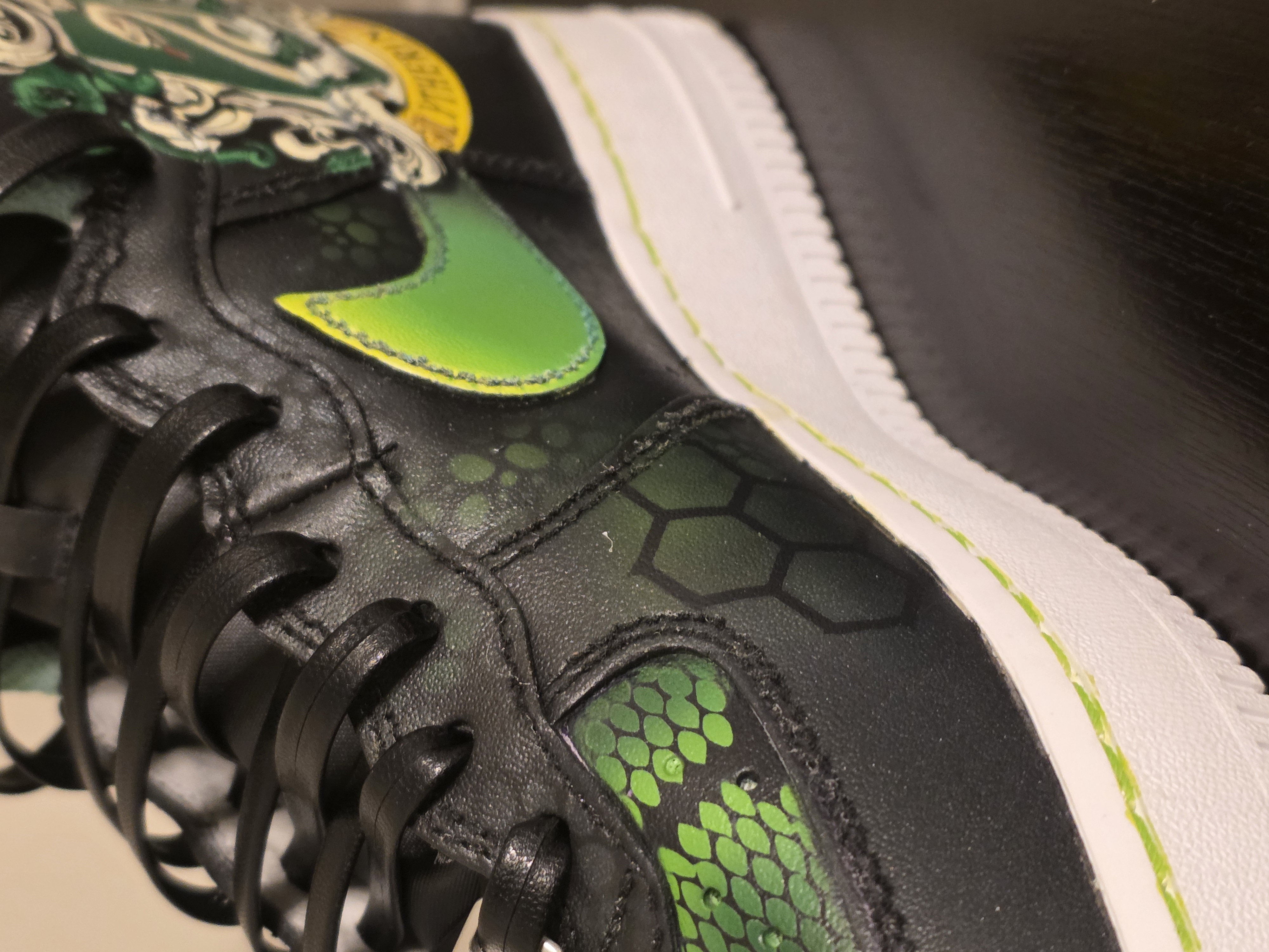 Custom Slytherin-themed Nike Air Force 1 with green snake scale pattern